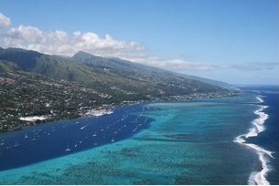 Reefs breaking waves to create calm water before shore